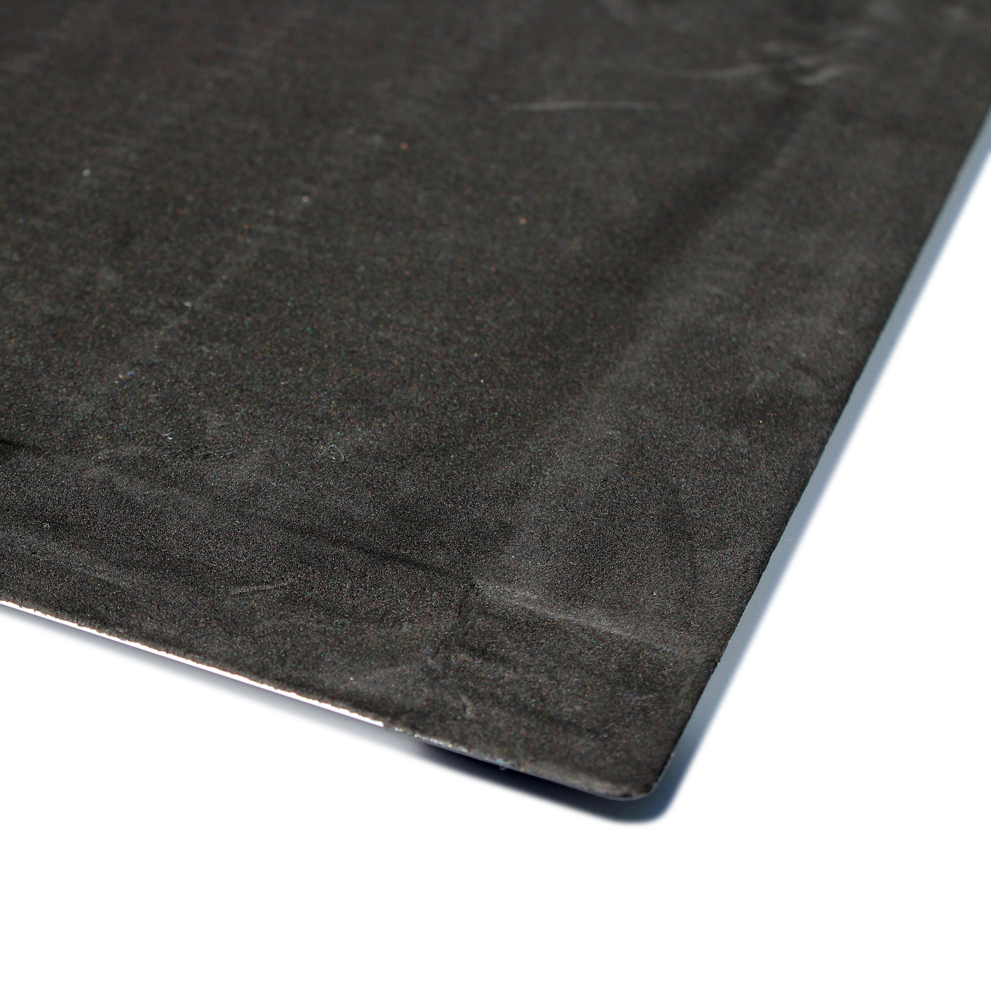 Close-up of the underside corner of the Hometex Premium Aluminium Indoor Entrance Mat, showing anti-slip backing