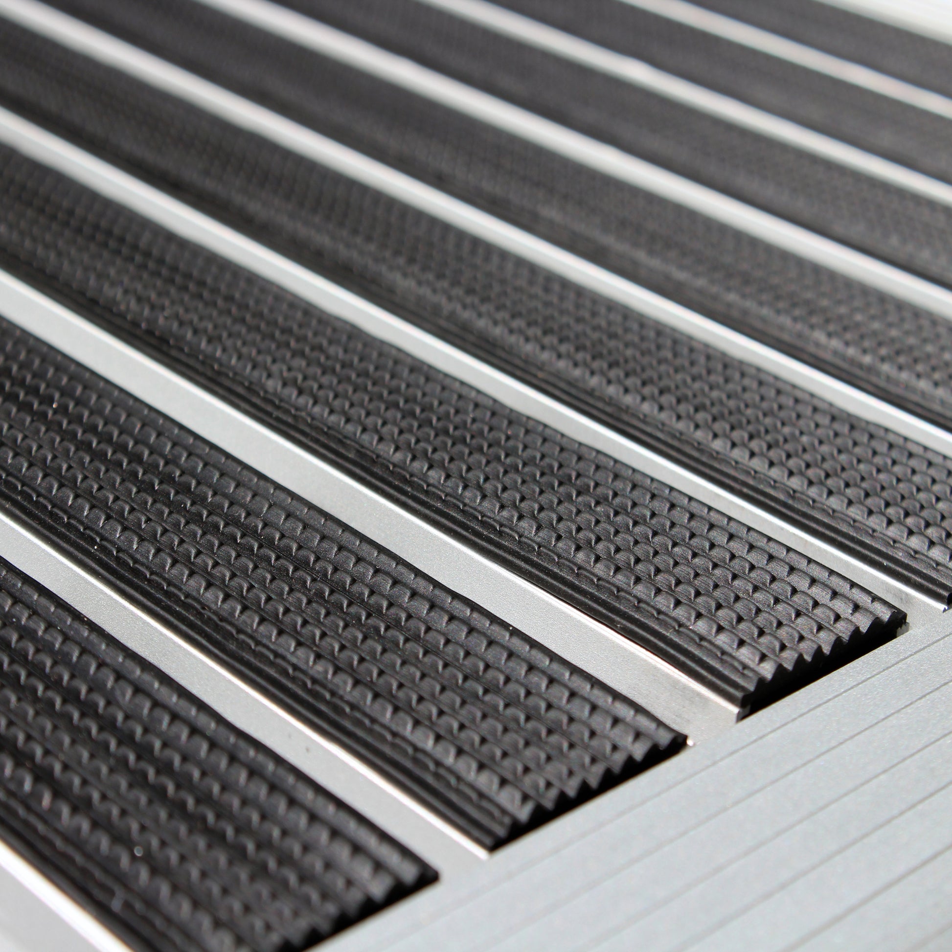 Angled close-up of the Hometex Premium Aluminium Outdoor Entrance Mat center, showcasing durable aluminium surface and anti-slip texture