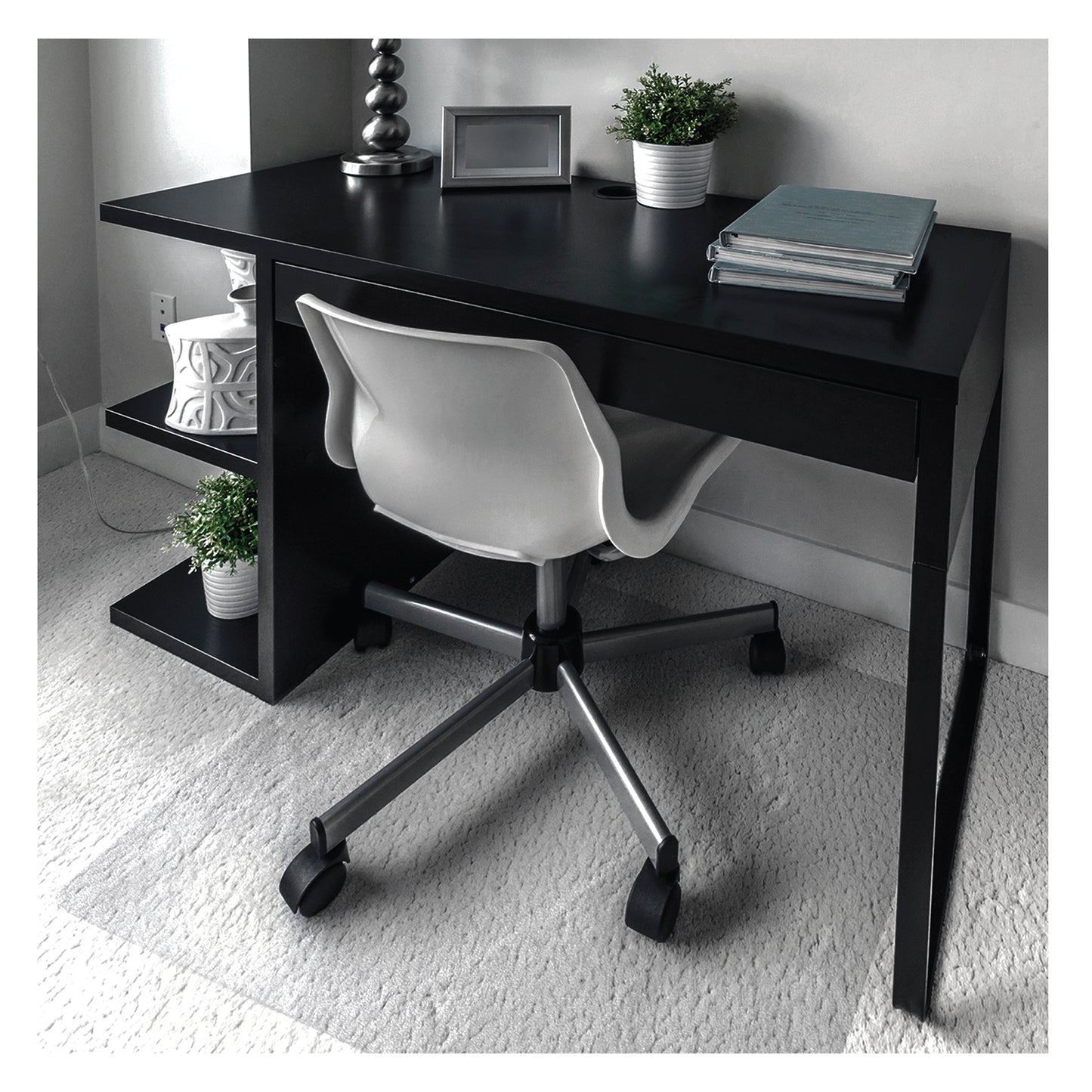 Lifestyle image of the Premium Polycarbonate Chair Mat – For Standard Pile Carpets under a caster-wheel office chair at a home office desk setup.