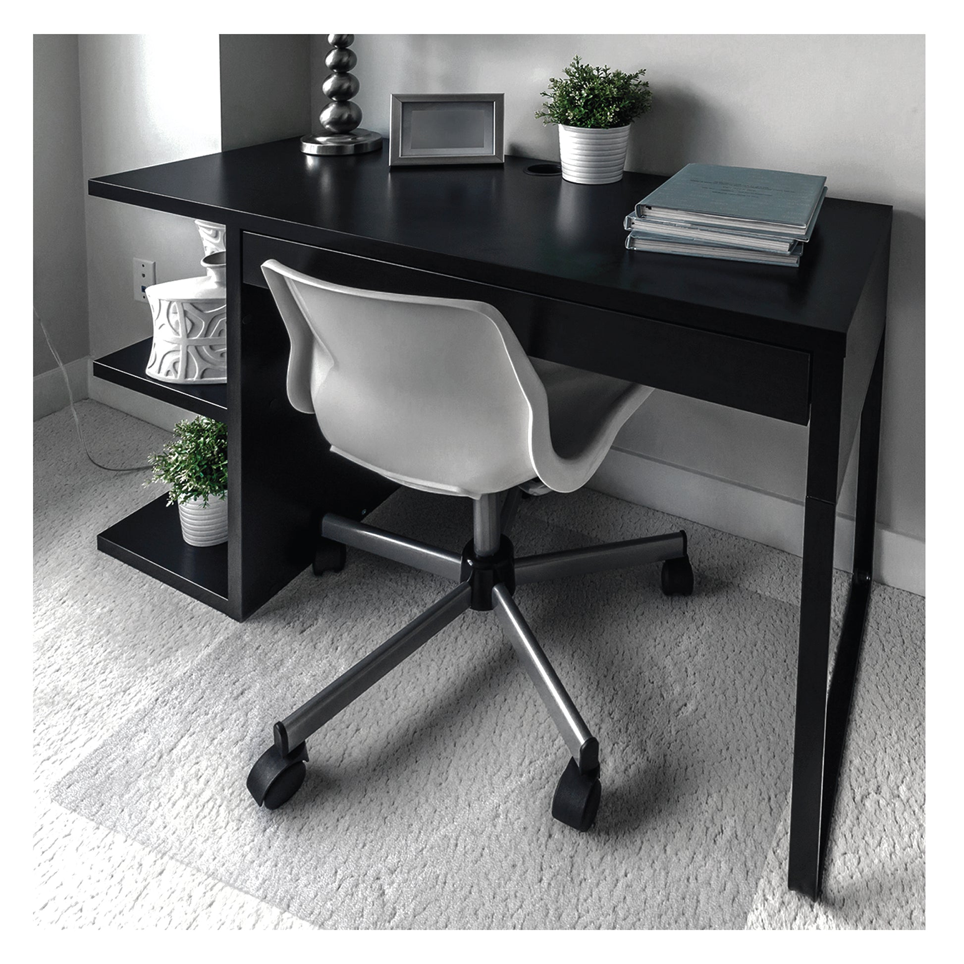 Lifestyle image of the Premium Polycarbonate Chair Mat – For Standard Pile Carpets under a caster-wheel office chair at a home office desk setup.