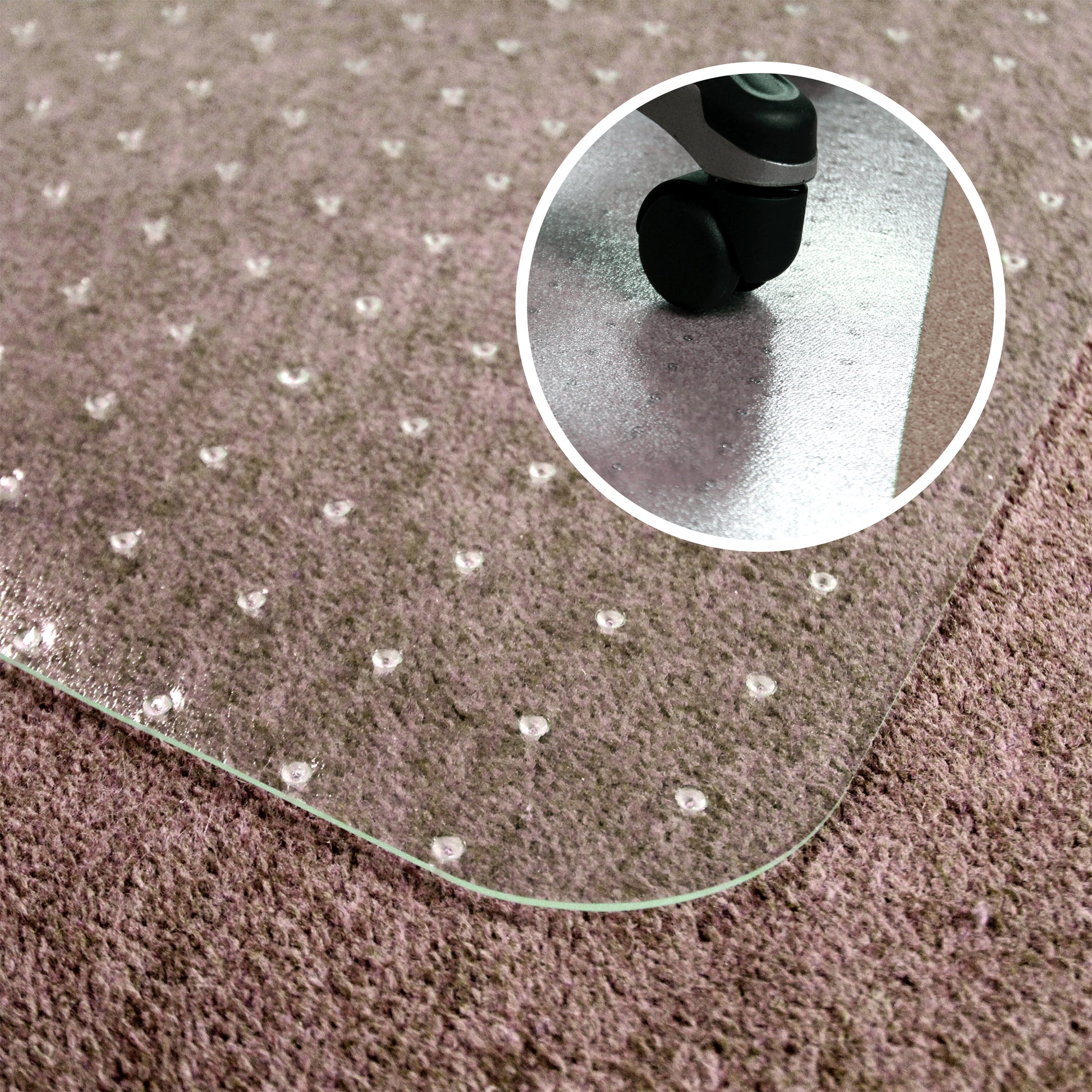 Close-up of the Universal PVC Chair Mat – For Low Pile Carpets on carpet, highlighting the carpet grippers, with a circular inset showing a caster chair wheel on the mat.
