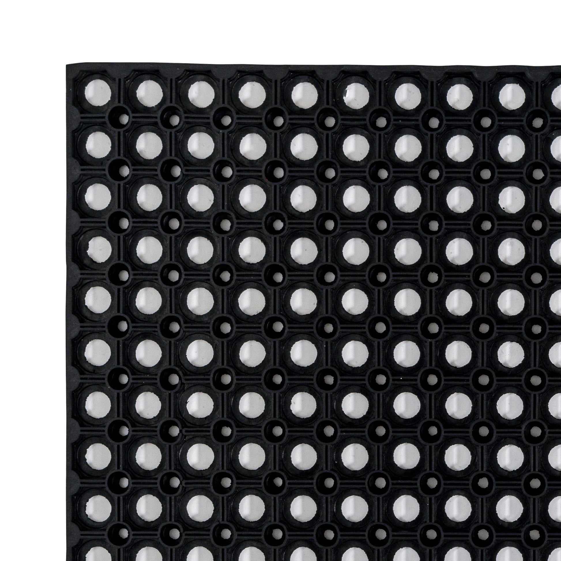 A detailed closeup of the Hometex All Seasons Outdoor Entrance Mat, a black  textured mat with circular patterns