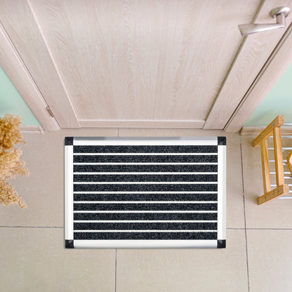 Hometex Premium Aluminium Indoor Entrance Mat positioned indoors near a doorway in a lifestyle setting