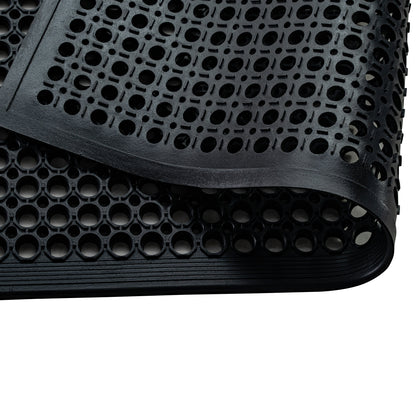Folded All Weather Outdoor Entrance Mat showing heavy-duty honeycomb pattern and anti-slip backing in close-up